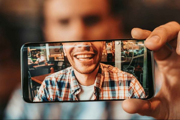 taking picture for direct to consumer orthodontics