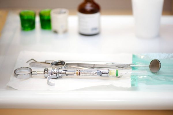 A dentist working at an urgent dental care centre in Manchester has said the practice has received threats from people with dental pain